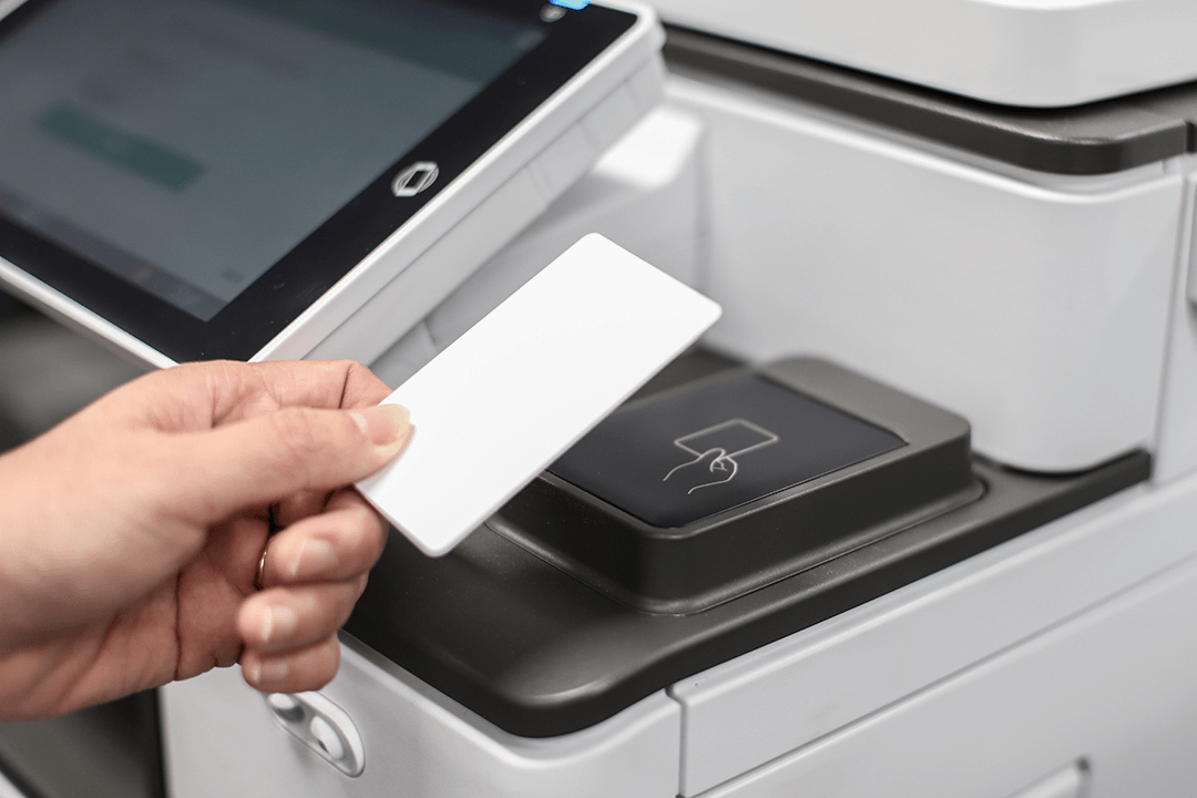 A swipe card being used to access a printer running PaperCut MF